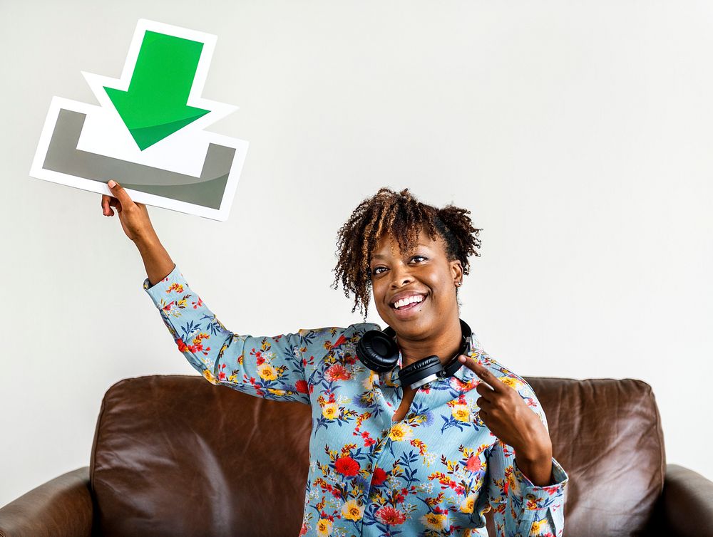 African American woman holding a download sign music and download concept