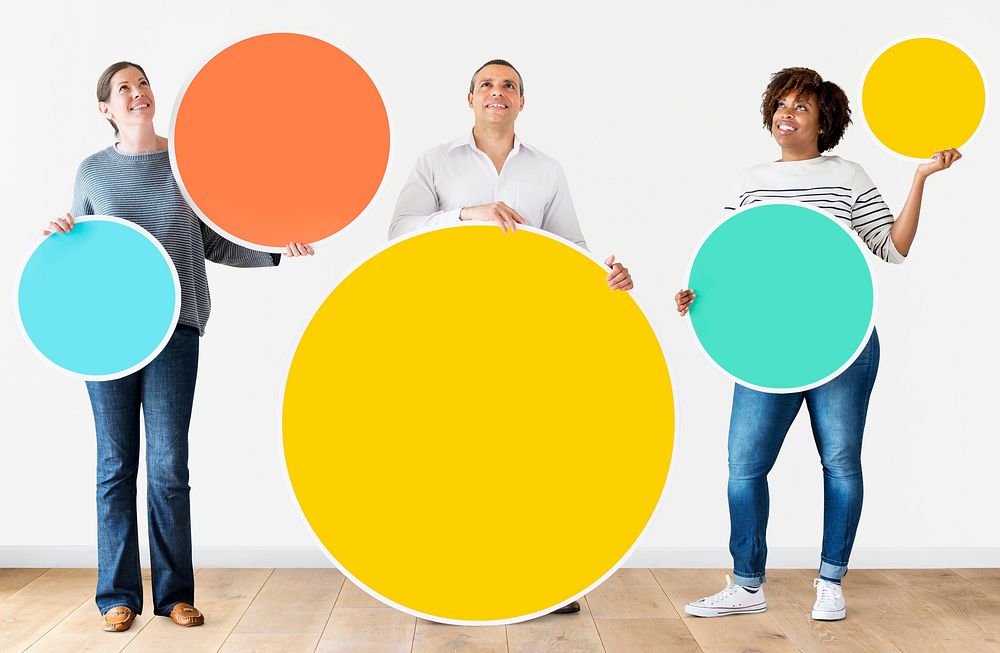 Diverse people holding colorful circles