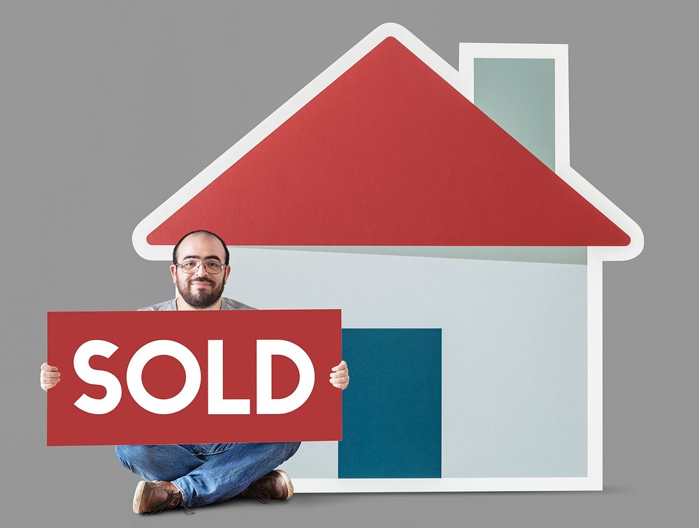 Man holding poster with house mockup