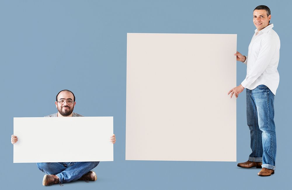 Men holding blank space boards