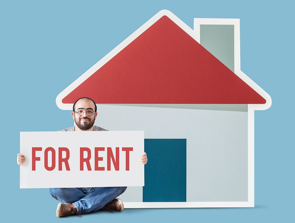 Man holding poster with house mockup