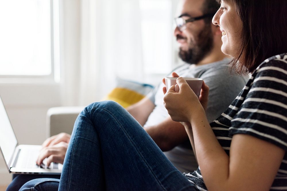 Happy couple relaxing at home