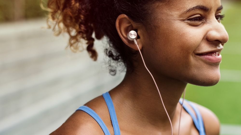 Girl smiling while listening to music