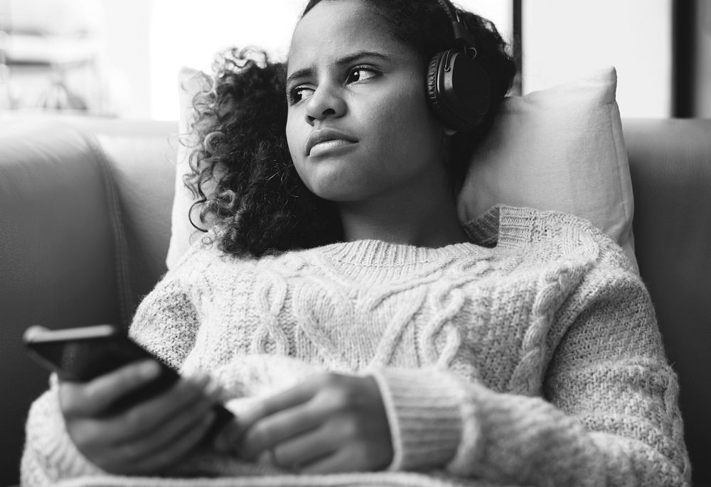 Woman listening to music with headphones on