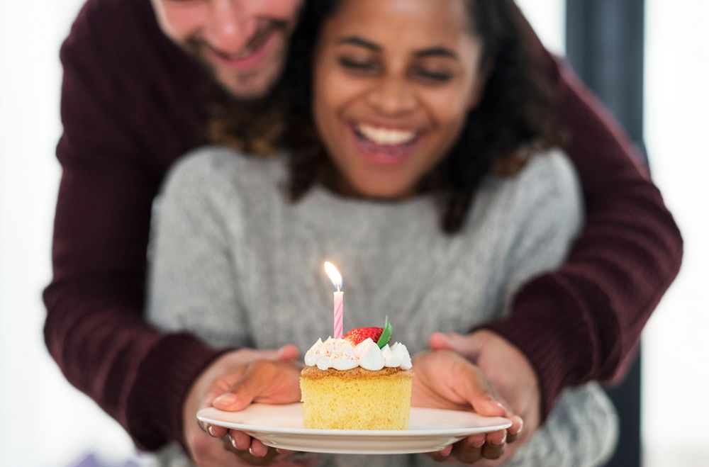 Woman celebrating birthday with a cake