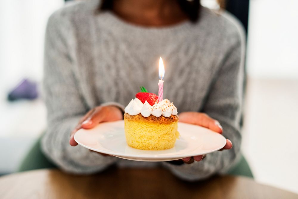 Woman celebrating birthday with a cake