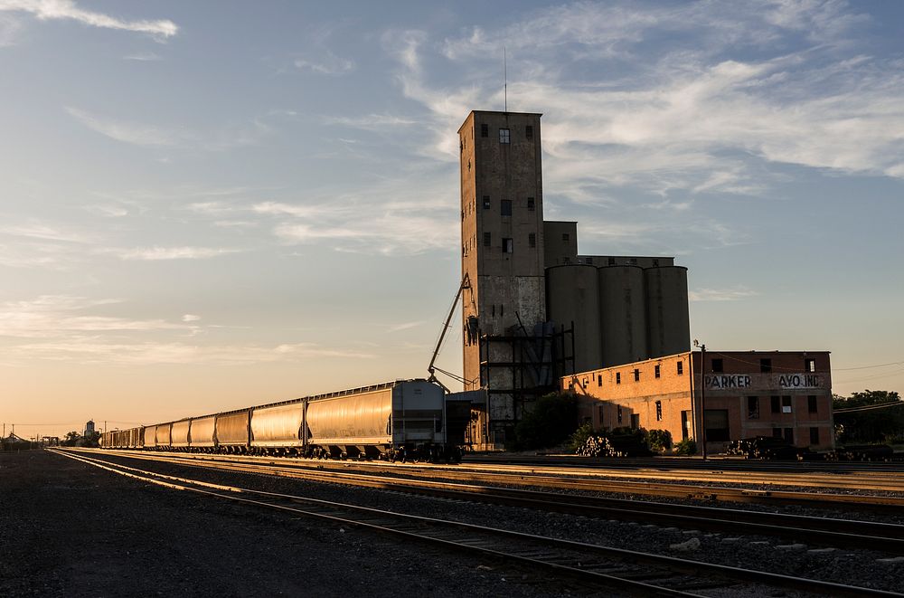 A grain elevator adjoins freight-rail tracks in Wichita Falls, Texas. Original image from Carol M. Highsmith&rsquo;s…