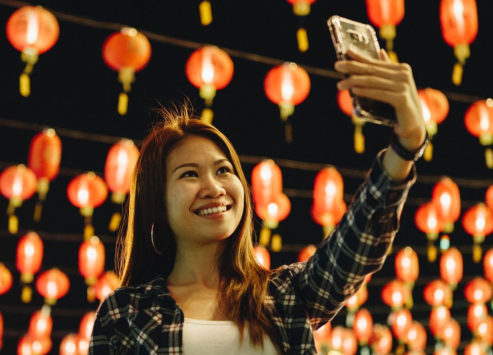 Woman taking selfie at lantern festval