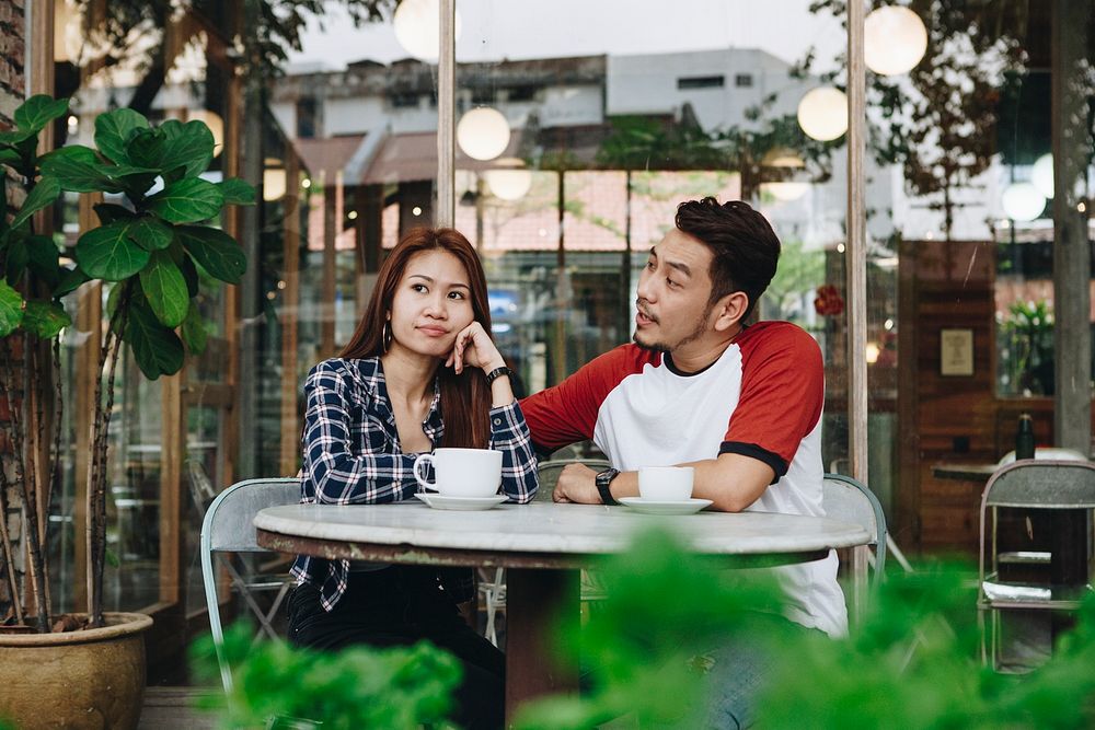 Lovely asian couple having coffee