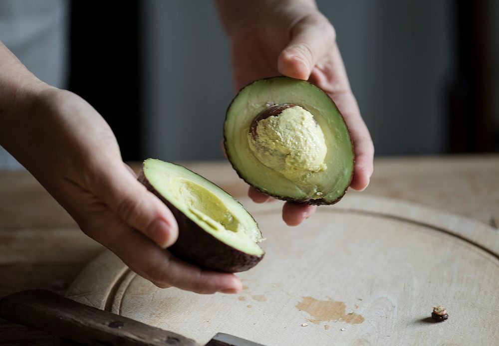 Organic avocado cut into halves food photography recipe idea