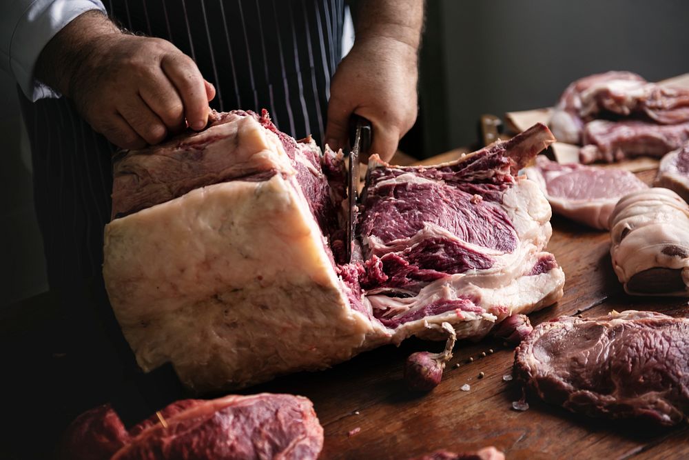 Butcher cutting rib eye steak food photography recipe idea