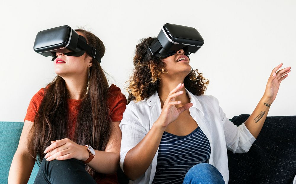Women experiencing the virtual reality goggles