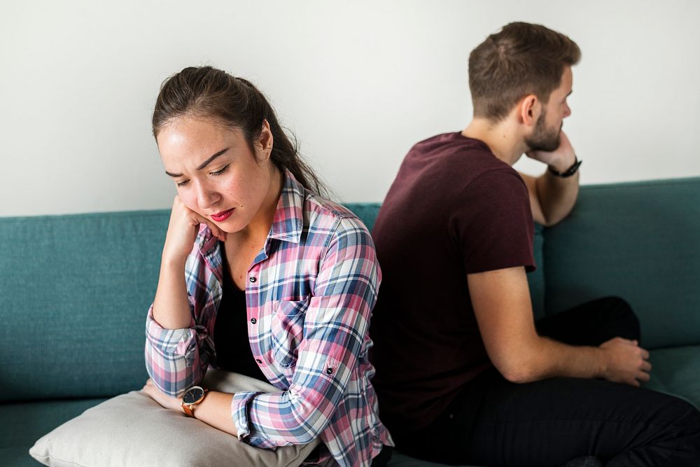 Unhappy couple not talking to one another