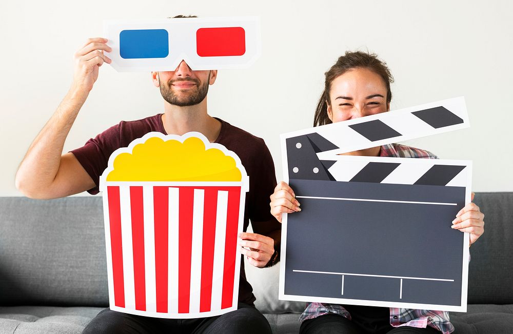 Couple watching movie at home together