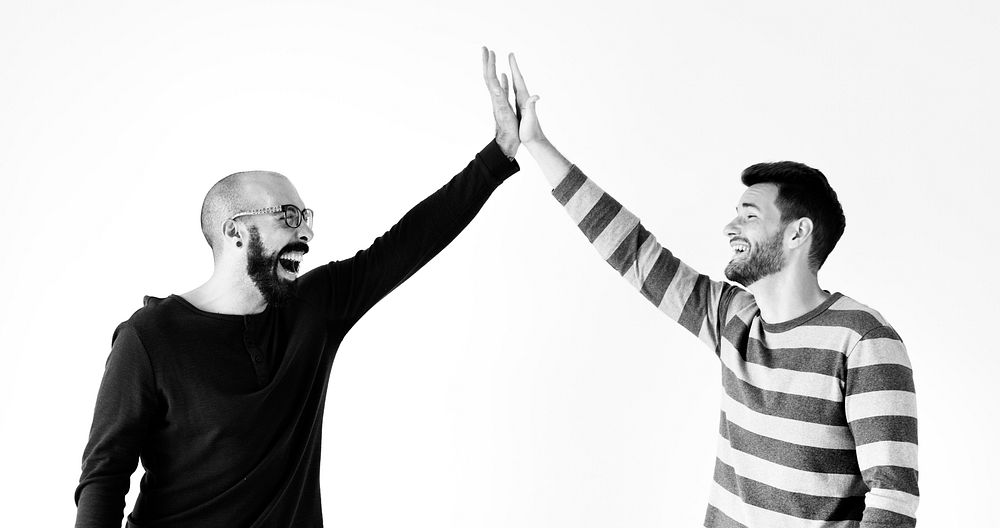 Two men giving a high five