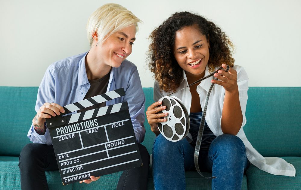 Young women with movie film reel