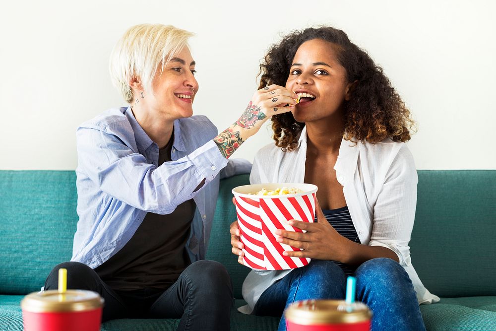 Young women watching a movie together