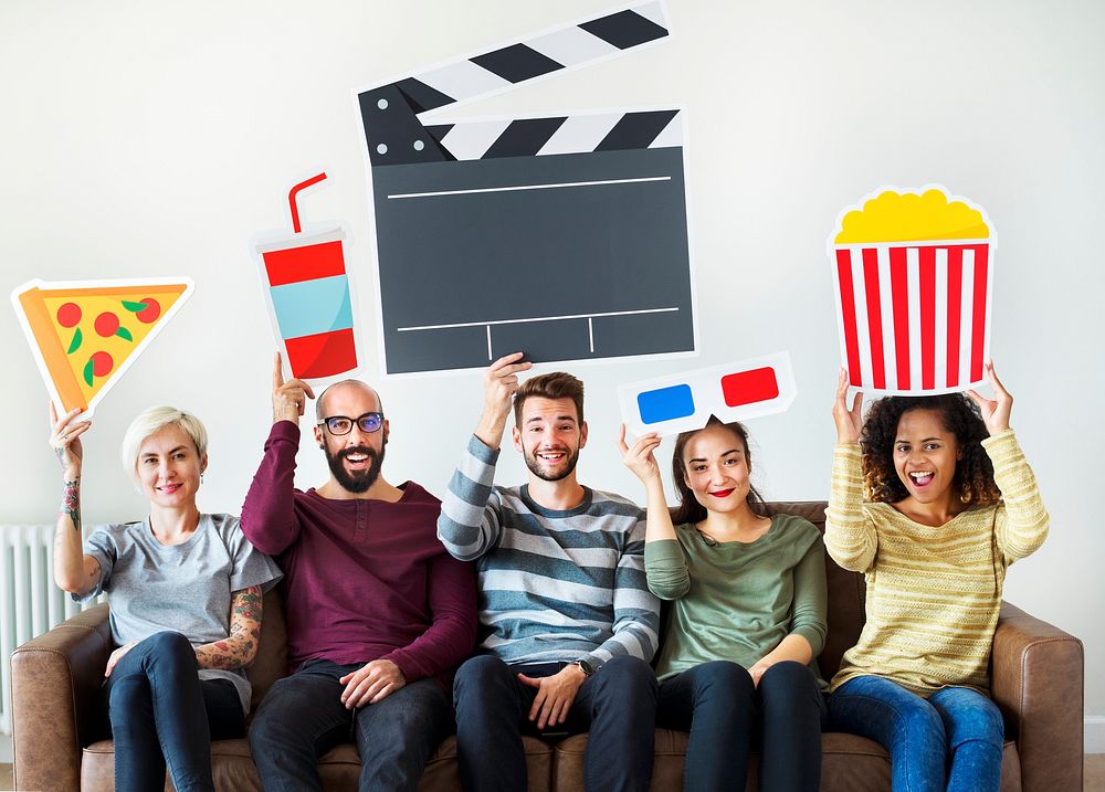Group of diverse friends watching movie together