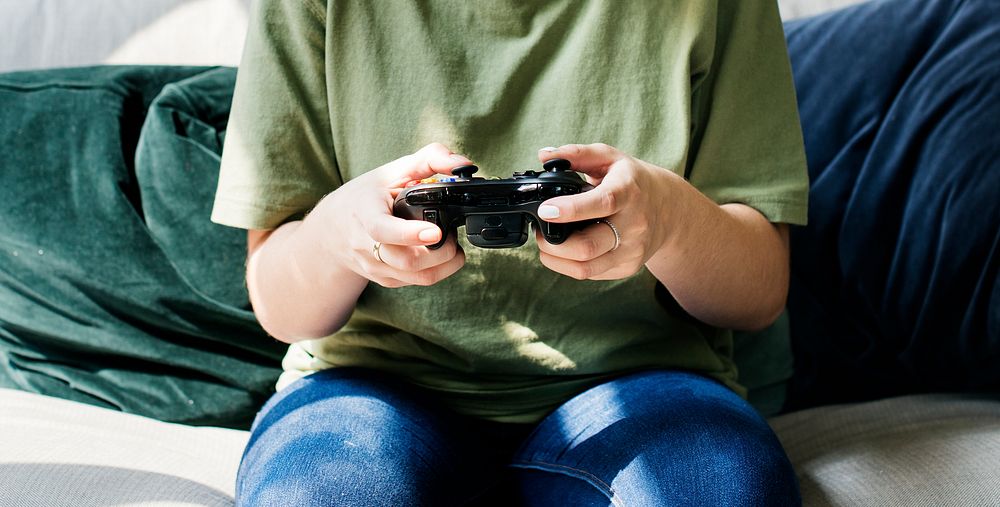 Woman playing video game alone