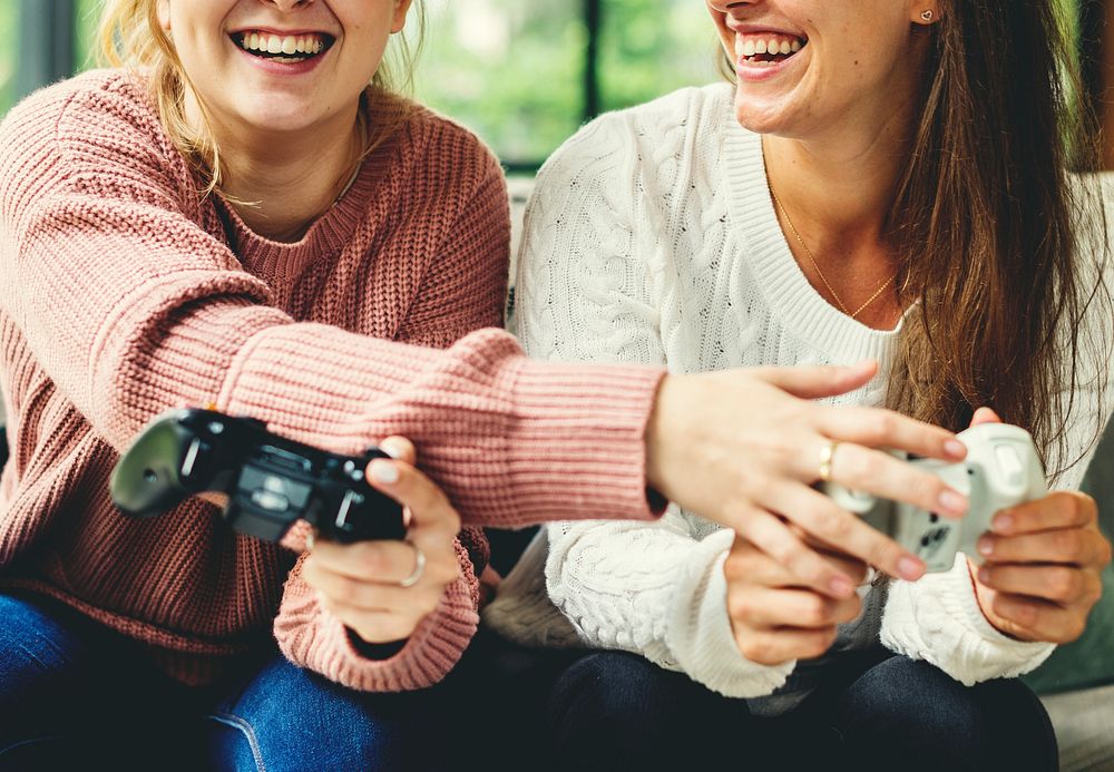 Women playing video game together