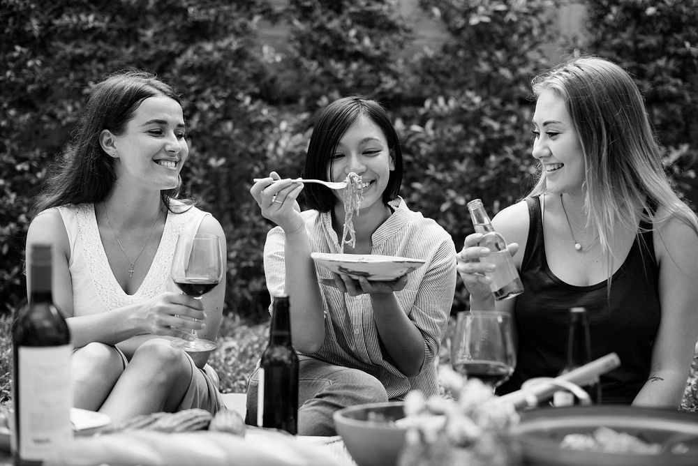 Diverse women enjoying food together