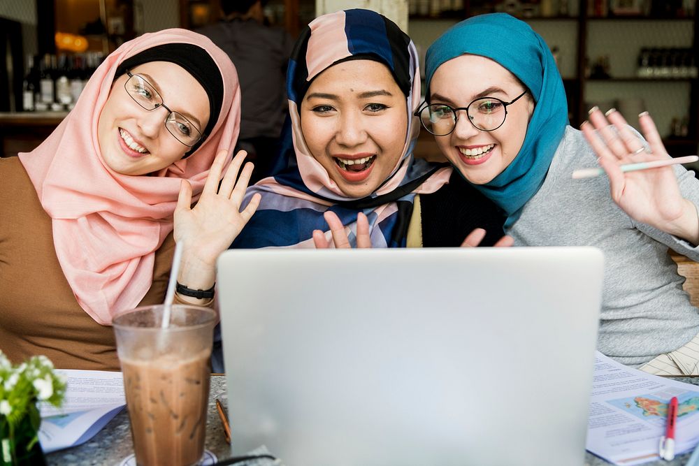 Islamic women friends using laptop for video call