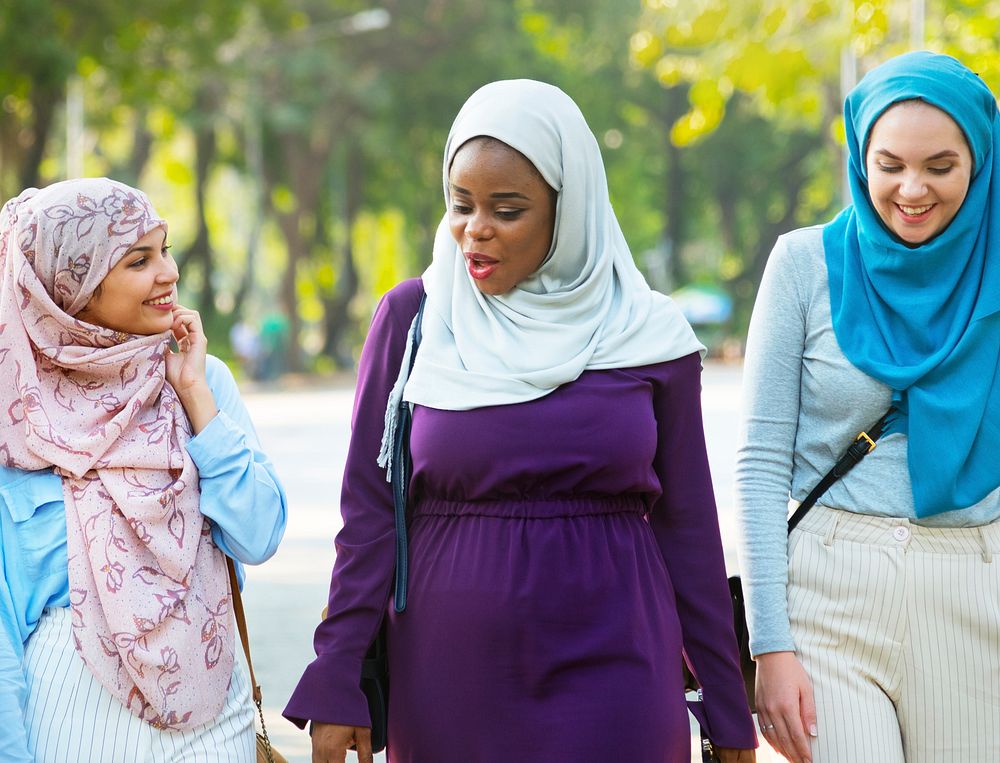 Islamic women friends walking and discussing together