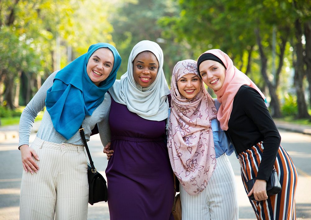 Group of islamic friends embracing and smiling together