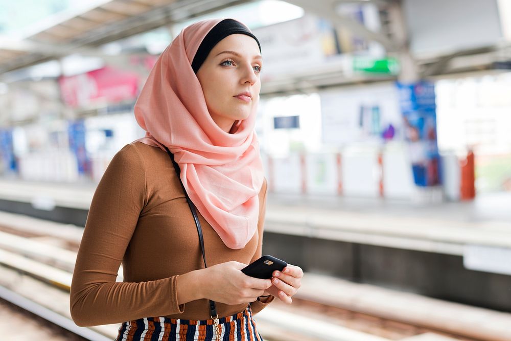 Islamic woman waiting for sky train