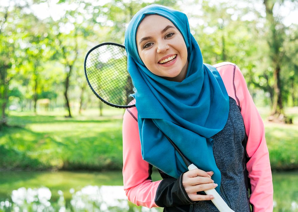 Muslim woman with badminton racket
