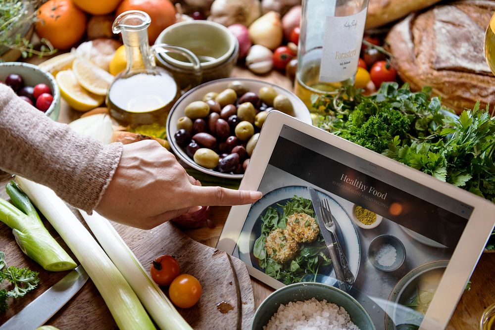 Woman reading healthy foods recipe on a tablet