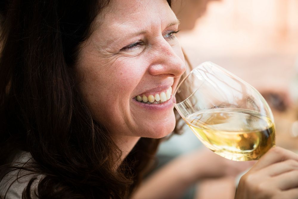 Happy woman with a glass of wine