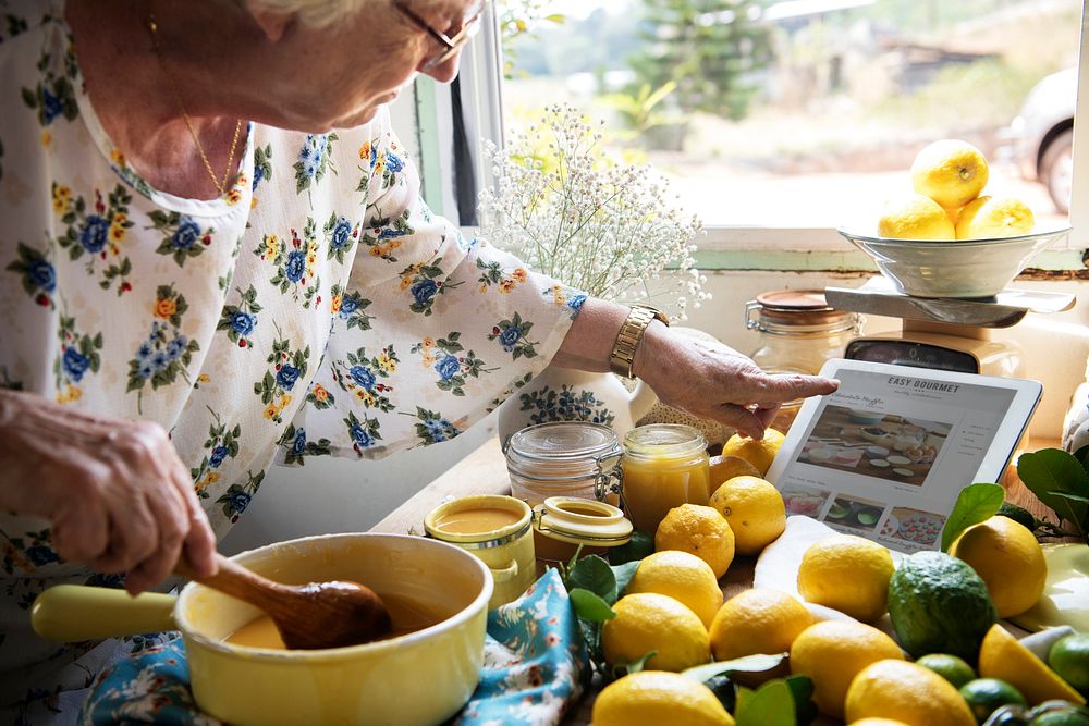 Elderly woman making lemon curd food photography recipe idea