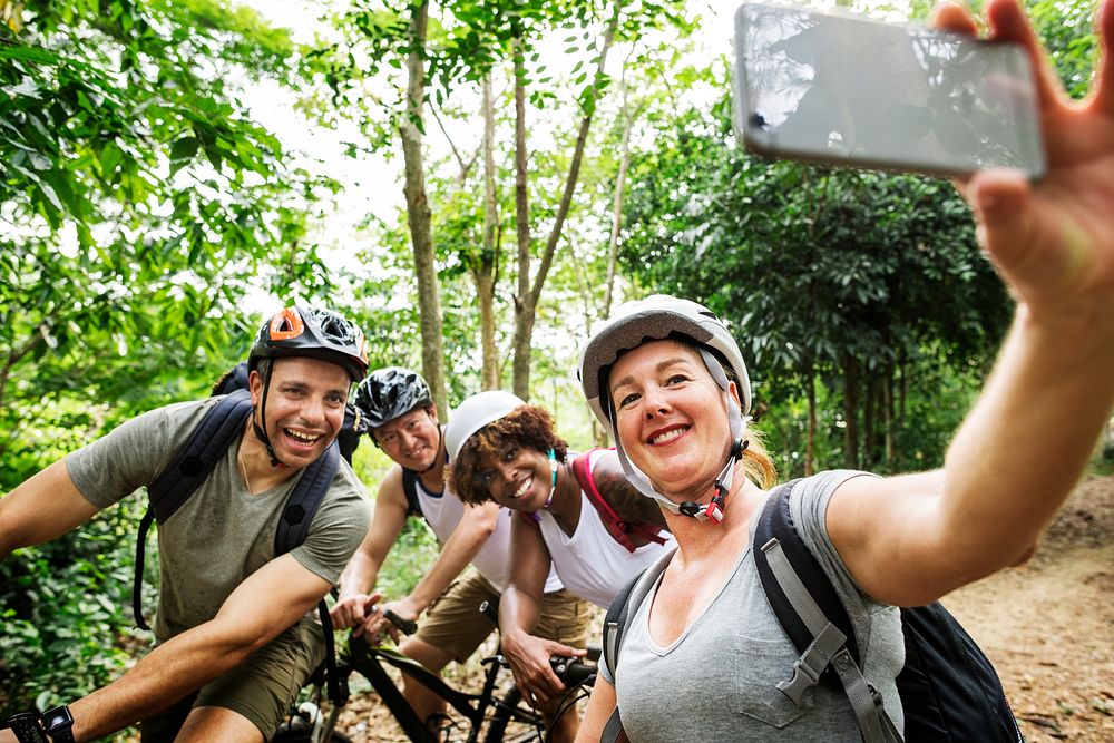 Group of diverse cyclists in the forest