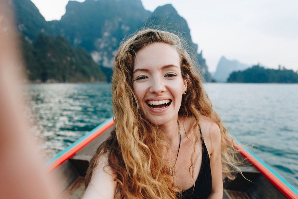 Beautiful woman posing on a boat