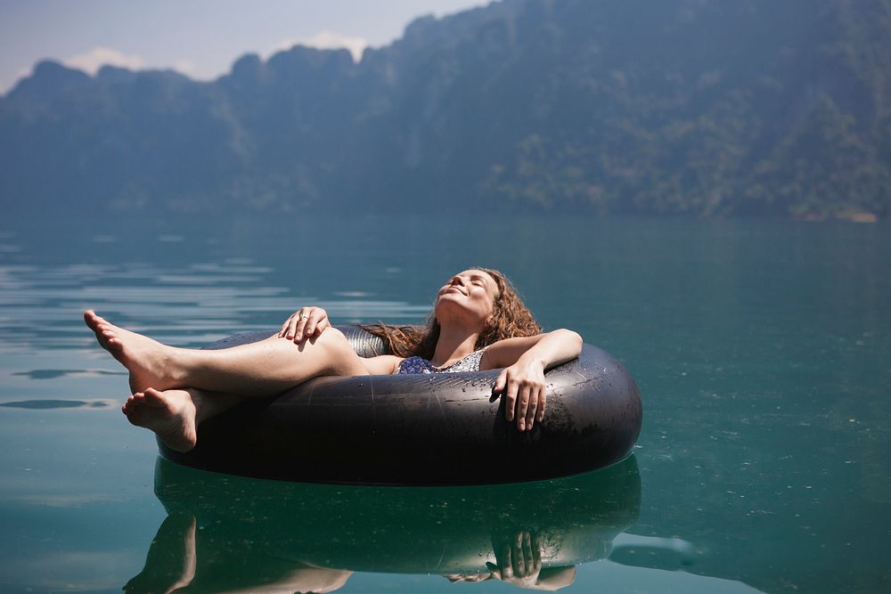 Woman relaxing on a floating ring