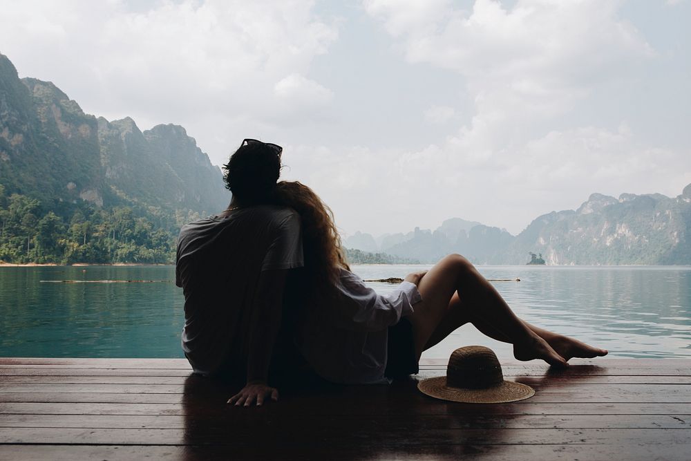 Woman relaxing in her boyfriends lap