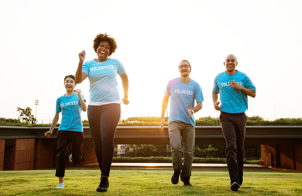 Group of happy and diverse volunteers