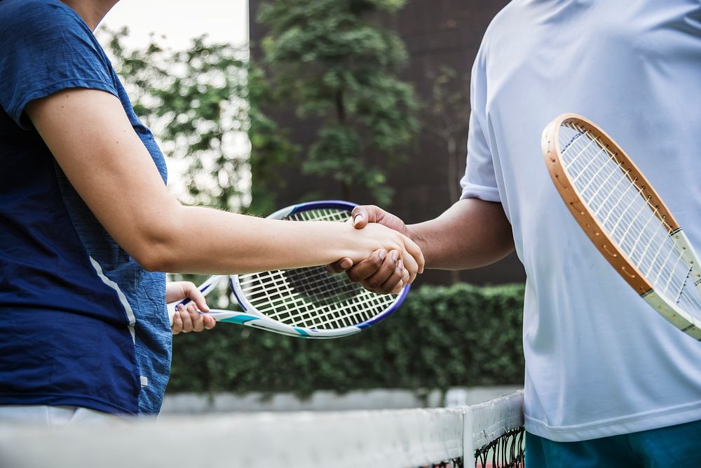Tennis players shaking hands after a good match