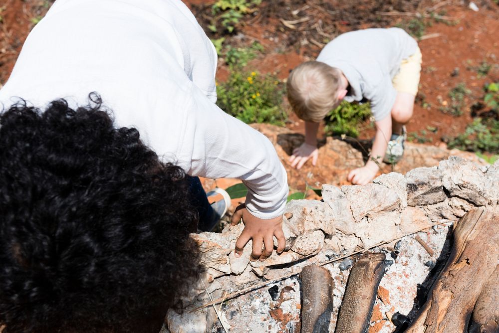 Two little boys climbing rock | Free Photo - rawpixel