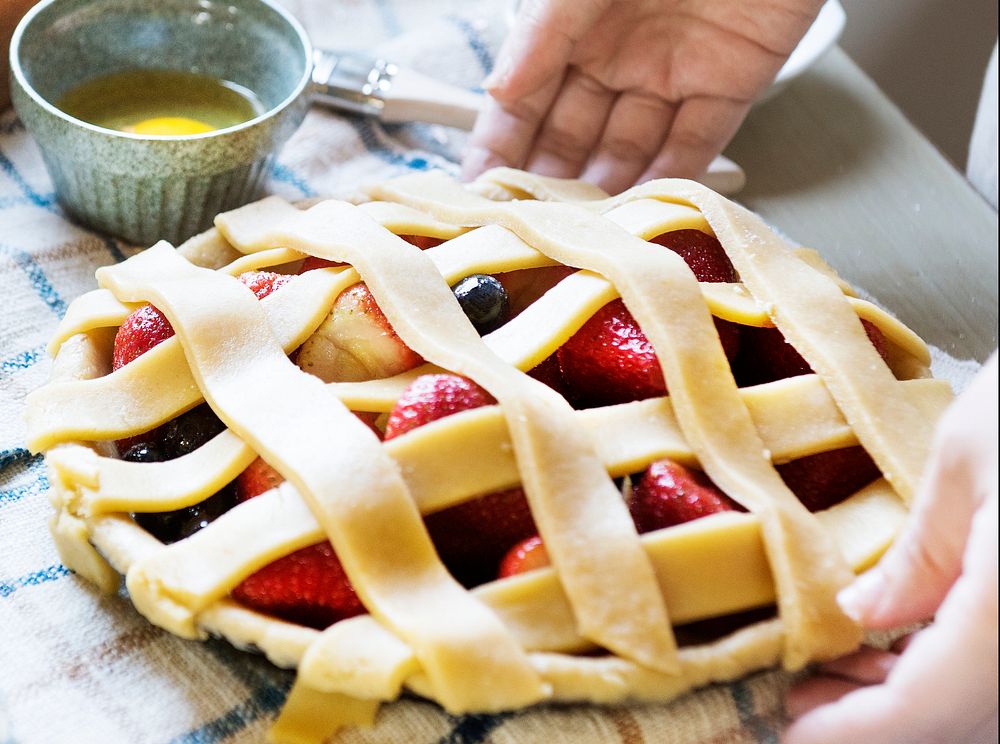 A person baking fruit pie food photography recipe idea