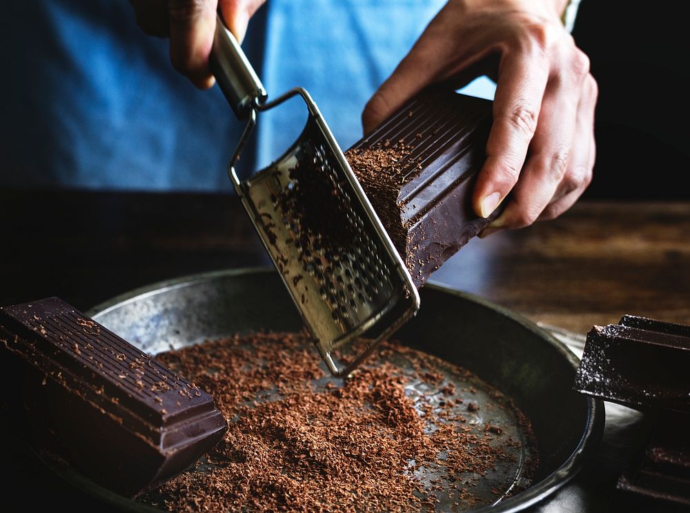 Woman grating a chocolate bar food photography recipe idea