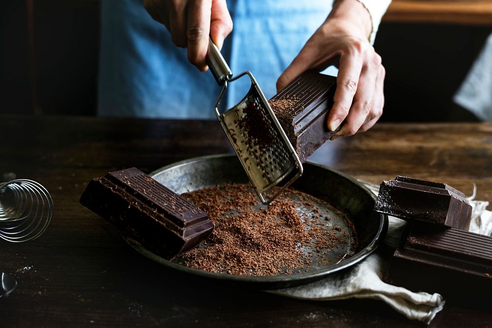 Woman grating a chocolate bar food photography recipe idea