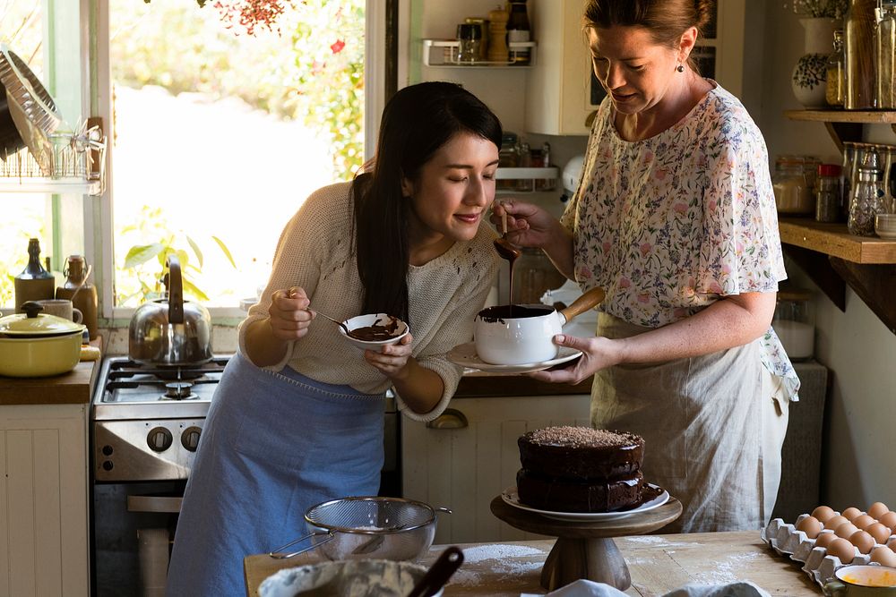 Women baking chocolate cake in the kitchen