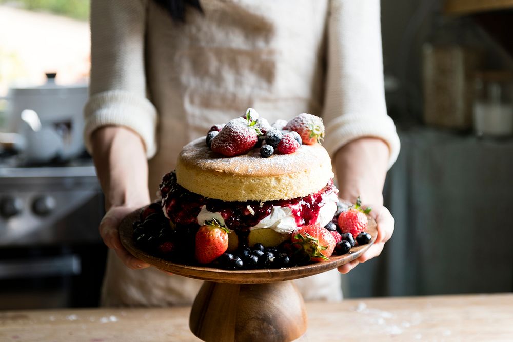 Layered cake decorated with mixed berries