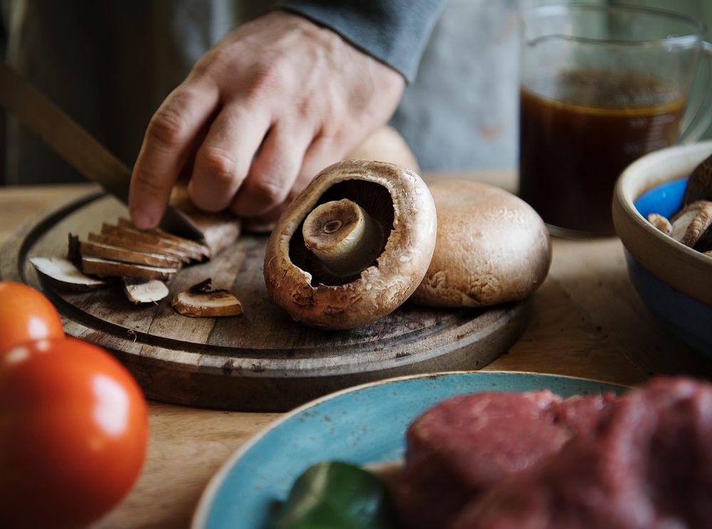 Closeup of slicing a mushroom food photography recipe idea