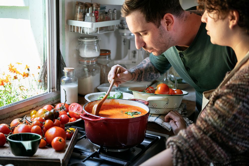 Couple making a tomato soup