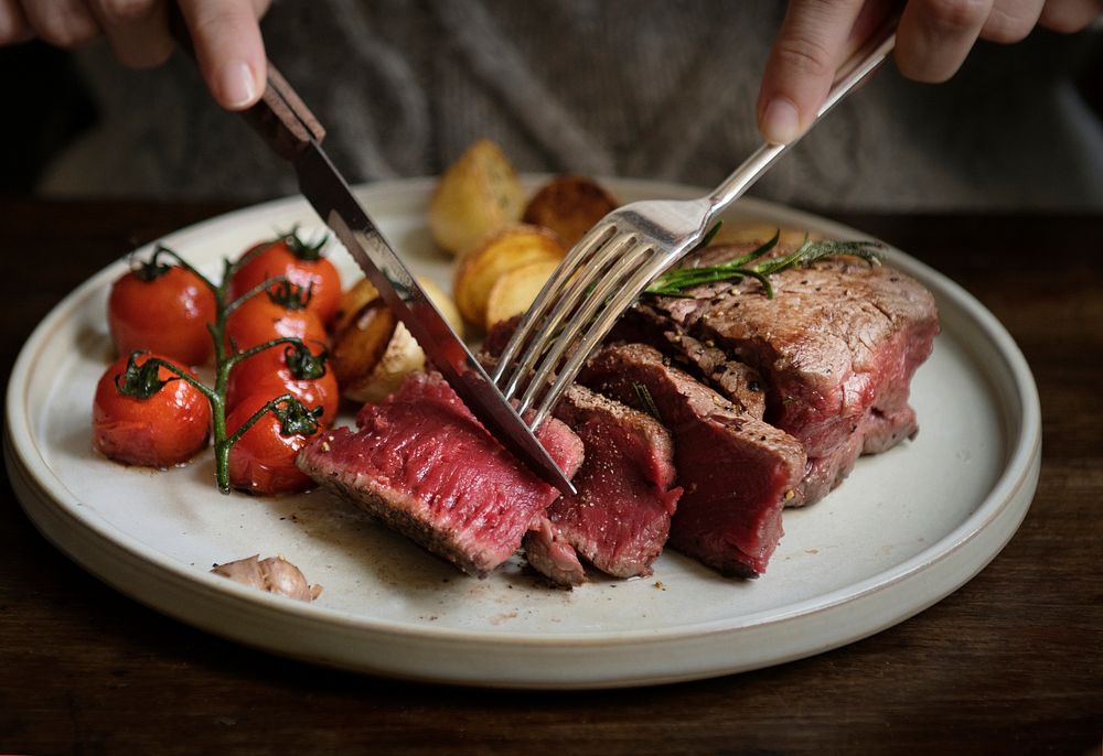 Close up of a cutting a fillet steak food photography recipe idea