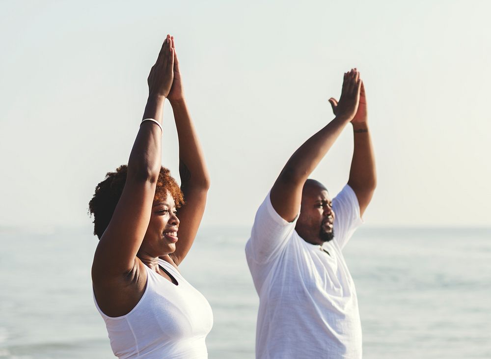 African American couple working out at the beach