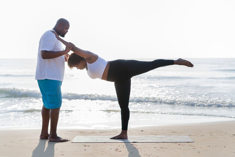 African American couple working out at the beach